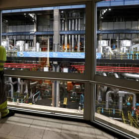 ​Workers survey the offline turbine hall in the UK’s last coal-fired power station (Picture: Darren Staples/AFP/Getty)