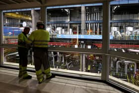 ​Workers survey the offline turbine hall in the UK’s last coal-fired power station (Picture: Darren Staples/AFP/Getty)