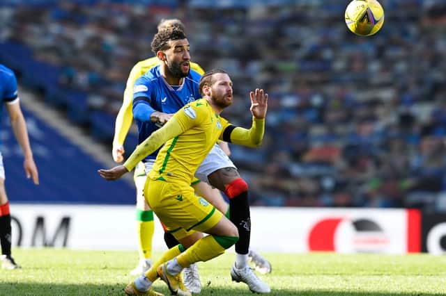 Rangers' Connor Goldson (left) battles with Hibernian's Martin Boyle during the league match between Rangers and Hibernian at Ibrox. Photo by Rob Casey / SNS Group