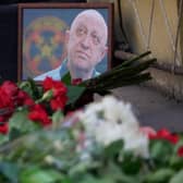 A portrait of Yevgeny Prigozhin is seen at the makeshift memorial in front of the circus building in Rostov-on-Don.