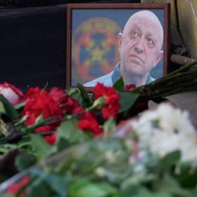 A portrait of Yevgeny Prigozhin is seen at the makeshift memorial in front of the circus building in Rostov-on-Don.