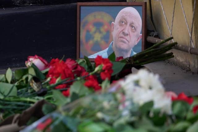 A portrait of Yevgeny Prigozhin is seen at the makeshift memorial in front of the circus building in Rostov-on-Don.