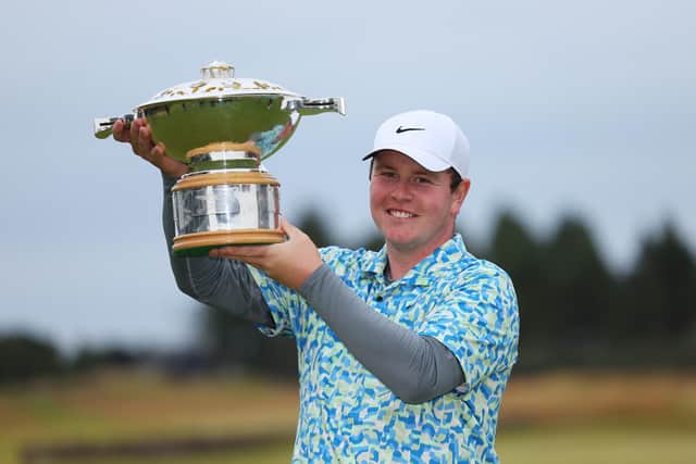 Bob MacIntyre shows off the trophy after his dramatic win in the Genesis Scottish Open at The Renaissance Club. Picture: Andrew Redington/Getty Images.