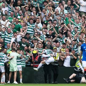 Celtic's players celebrate with fans after the big win over Rangers.