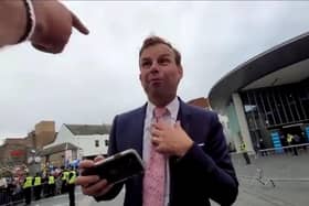 A screenshot of the video showing the abuse directed at the BBC's James Cook.