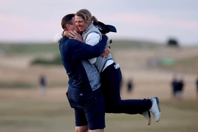 Ashleigh Buhai is lifted off her feet by husband day on the 18th green at at Muirfield. Picture: Charlie Crowhurst/Getty Images.