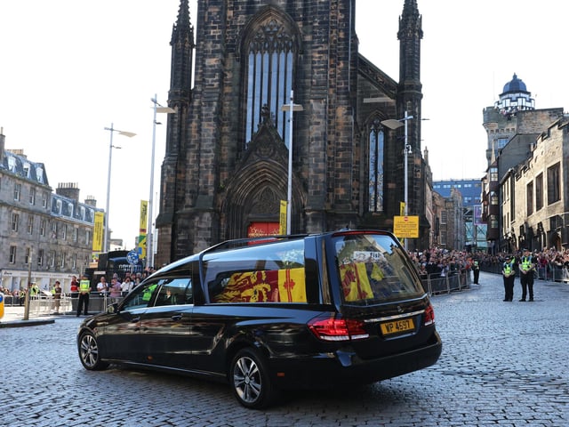 The hearse carrying the coffin of Queen Elizabeth II departs St Giles' Cathedral, for Edinburgh Airport, where was flown by the Royal Air Force to RAF Northolt.