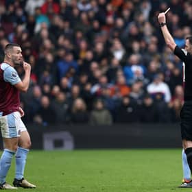 John McGinn is sent off by referee Chris Kavanagh during Aston Villa's 4-0 defeat by Tottenham Hotspur.
