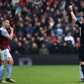 John McGinn is sent off by referee Chris Kavanagh during Aston Villa's 4-0 defeat by Tottenham Hotspur.