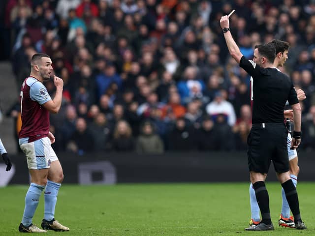 John McGinn is sent off by referee Chris Kavanagh during Aston Villa's 4-0 defeat by Tottenham Hotspur.