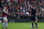 John McGinn is sent off by referee Chris Kavanagh during Aston Villa's 4-0 defeat by Tottenham Hotspur.