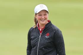 Lottie Woad smiles on  her way to winning the Smyth Salver as leading amateur in the AIG Women's Open at St Andrews. Picture: Michael Reaves/Getty Images.