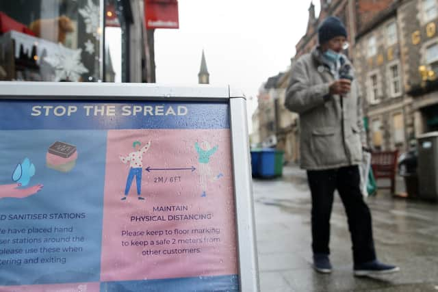 A sign advising customers about the spread of coronavirus outside a shop in Stirling.