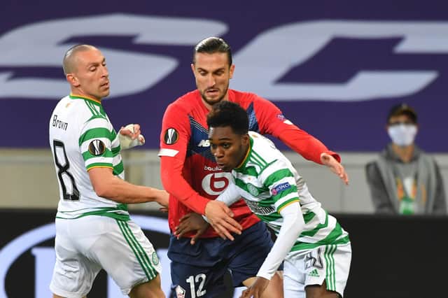 Scott Brown and Jeremie Frimpong look to shut out Lille midfielder Yusuf Yazici at the Grand Stade Pierre-Mauroy