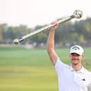 Dane Nicolai Hojgaard poses with the DP World Tour Championship trophy after his two-shot success at Jumeirah Golf Estates in Dubai. Picture: Ross Kinnaird/Getty Images.
