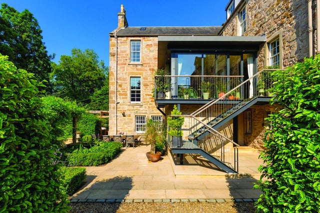 Woodhall House is surrounded by 7.8 acres of landscaped gardens and woodlands and features the flowing Water of Leith, which has been much enjoyed by the children and three dogs over the years.
There is a floodlit Astro-turf tennis court, hot tub, and seating to enjoy al fresco dining. There are also ample wildflower meadows.
Contact: Knight Frank