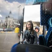 A young girl climbs aboard a bus bound for Przemyśl in Poland, carrying refugees from regions of Southern and Eastern Ukraine, including Mariupol.
