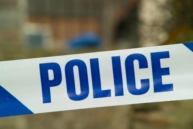 Police are treating a death as unexplained after human remains were found in a burnt-out vehicle in a country lane