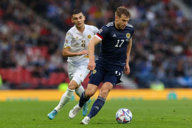 GLASGOW, SCOTLAND - JUNE 08: Stuart Armstrong of Scotland gets away from Eduard Spertsyan of Armenia during the UEFA Nations League League B Group 1 match between Scotland and Armenia at Hampden Park National Stadium on June 08, 2022 in Glasgow, Scotland. (Photo by Ian MacNicol/Getty Images)