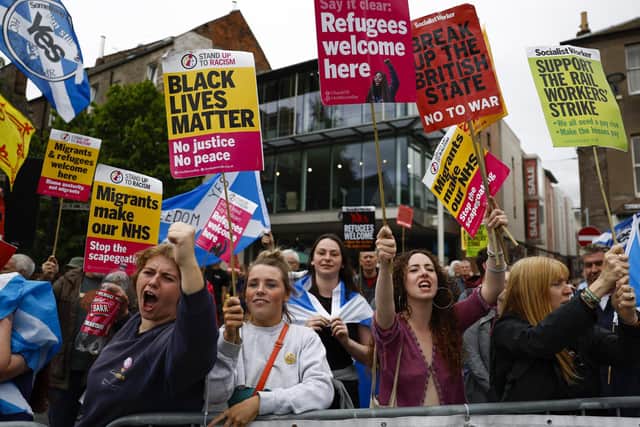 Protesters demonstrate outside the Conservative Party leadership hustings in Perth on August 16. Foreign Secretary, Liz Truss and former Chancellor Rishi Sunak are vying to become the new leader of the Conservative Party and the UK's next Prime Minister. (Photo by Jeff J Mitchell/Getty Images)