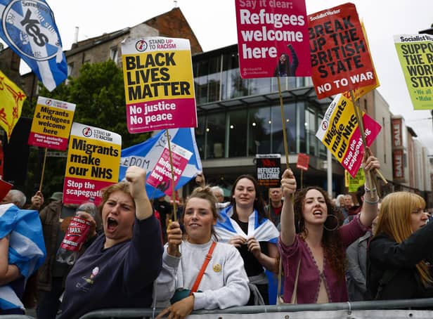 Protesters demonstrate outside the Conservative Party leadership hustings in Perth on August 16. Foreign Secretary, Liz Truss and former Chancellor Rishi Sunak are vying to become the new leader of the Conservative Party and the UK's next Prime Minister. (Photo by Jeff J Mitchell/Getty Images)