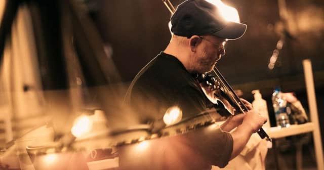 Aidan O’Rourke is a multi-award-winning fiddler, composer, producer, curator and one third of Scotland’s most inventive folk band, Lau.