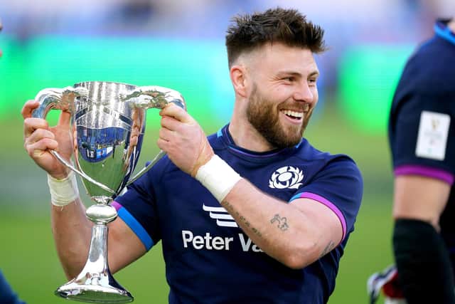 Scotland's Ali Price celebrates with the Cuttitta Cup after the win over Italy. Picture: Mike Egerton/PA Wire