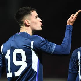Max Johnston blows a kiss to his supporters in the Fir Park stand after giving Scotland Under-21's the lead against Iceland Under-21 at Motherwell. Photo by Ross MacDonald / SNS Group