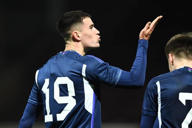 Max Johnston blows a kiss to his supporters in the Fir Park stand after giving Scotland Under-21's the lead against Iceland Under-21 at Motherwell. Photo by Ross MacDonald / SNS Group