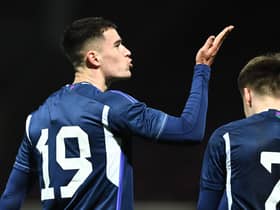 Max Johnston blows a kiss to his supporters in the Fir Park stand after giving Scotland Under-21's the lead against Iceland Under-21 at Motherwell. Photo by Ross MacDonald / SNS Group