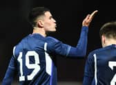 Max Johnston blows a kiss to his supporters in the Fir Park stand after giving Scotland Under-21's the lead against Iceland Under-21 at Motherwell. Photo by Ross MacDonald / SNS Group