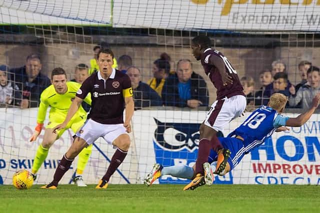 Hearts will open their campaign with a trip to Peterhead where they suffered a shock 2-1 defeat in the tournament four years ago. Arnauld Djoum is pictured fouling Jordon Brown for the penalty which decided that match at Balmoor. (Photo by Alan Harvey/SNS Group).