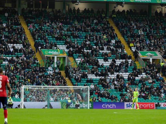 There were gaps in the crowd at Celtic Park - no doubt due to the poor weather.