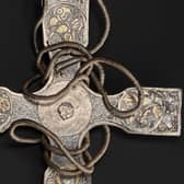 The pectoral cross after conservation with porcupine quills among the fine hand tools used to remove corrosion and dirt from the treasure. PIC: NMS.