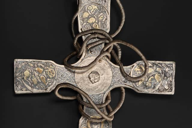 The pectoral cross after conservation with porcupine quills among the fine hand tools used to remove corrosion and dirt from the treasure. PIC: NMS.