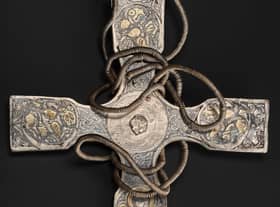 The pectoral cross after conservation with porcupine quills among the fine hand tools used to remove corrosion and dirt from the treasure. PIC: NMS.
