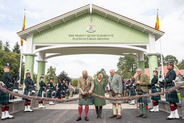 Prince Charles, Prince of Wales and Camilla, Duchess of Cornwall, known as the Duke and Duchess of Rothesay while in Scotland, officially open the Queen Elizabeth Platinum Jubilee Archway during the Braemar Royal Highland Gathering