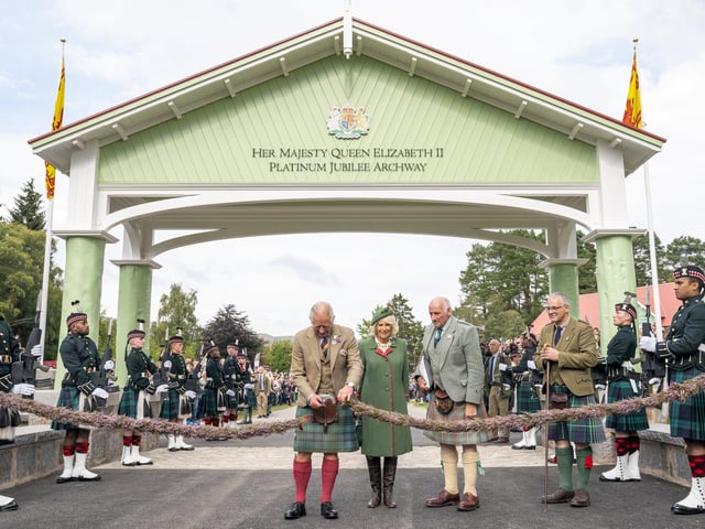 Prince Charles, Prince of Wales and Camilla, Duchess of Cornwall, known as the Duke and Duchess of Rothesay while in Scotland, officially open the Queen Elizabeth Platinum Jubilee Archway during the Braemar Royal Highland Gathering