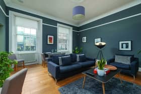 The one-bedroomed bolthole’s modern decor utilises a satisfyingly rich dark palette, which contrasts nicely with the apartment’s traditional fixtures and fittings. Image: contributed