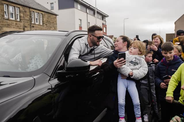 Boxer Josh Taylor arrives in Prestonpans and is greeted by fans after becoming four-belt undisputed champion. (Credit: Euan Cherry)