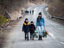 Refugees should be able to claim asylum in the UK whether they are fleeing war, like these Ukrainians, or persecution on the grounds of their sexuality (Picture: Peter Lazar/AFP via Getty Images)