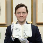 Leo Webster of Bonhams Auctioneers with one of the sketchbooks