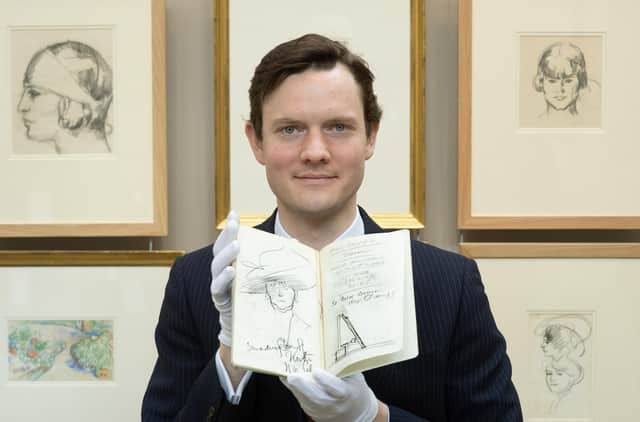 Leo Webster of Bonhams Auctioneers with one of the sketchbooks