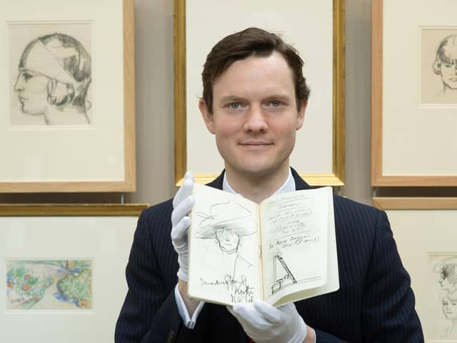 Leo Webster of Bonhams Auctioneers with one of the sketchbooks