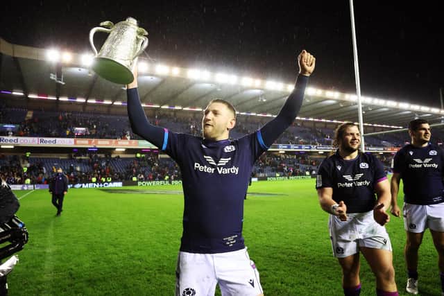 Finn Russell celebrates with the Calcutta Cup after Scotland's 20-17 win over England.  (Photo by Craig Williamson / SNS Group)