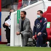 England's manager Gareth Southgate and  Steve Holland, assistant coach of England, 'take a knee'. Picture: Getty Images