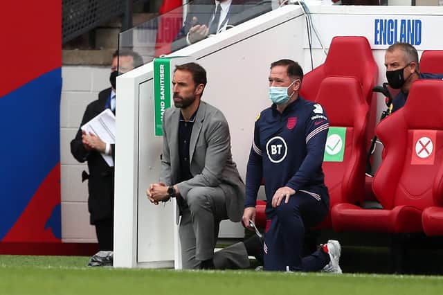 England's manager Gareth Southgate and  Steve Holland, assistant coach of England, 'take a knee'. Picture: Getty Images