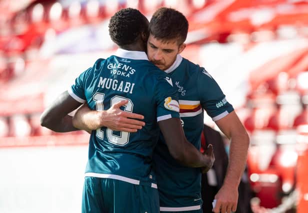 Motherwell defender Bevis Mugabi has dislocated his shoulder.