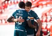Motherwell defender Bevis Mugabi has dislocated his shoulder.