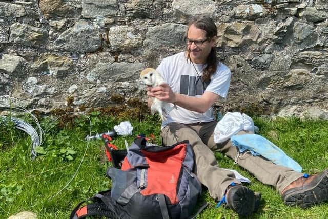 Dr Stewart White, from the University of Glasgow, has been tagging the owl chicks and helping monitor their progress